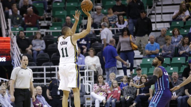 Shooting star: Utah Jazz guard Dante Exum hits a three-pointer during the big win over Charlotte on Monday.