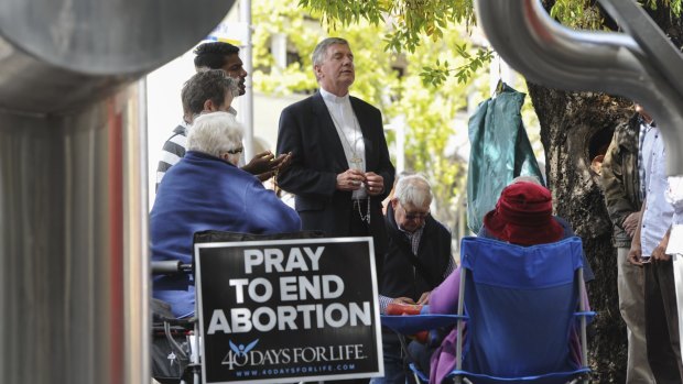 A prayer vigil outside a Canberra abortion clinic before it was made illegal.