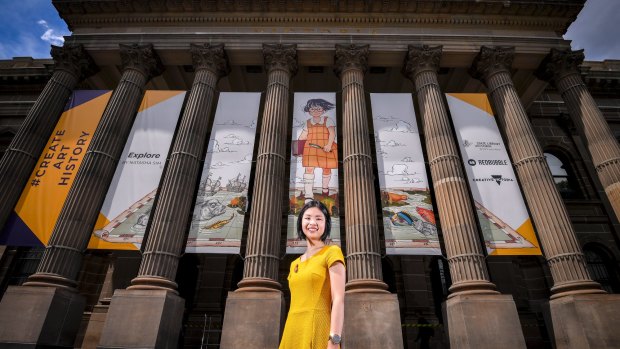 Hey that's me: Lawyer Natasha Sim with Explore, her whimsical portrait of herself aged 10, which will adorn the State Library of Victoria front entrance until the end of January. 