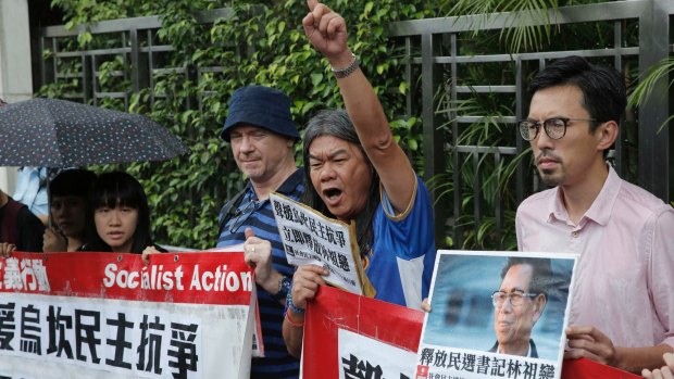 Radical pro-democracy lawmaker Leung Kwok-hung, second from right, and other protesters during a demonstration outside the Chinese central government's liaison office in Hong Kong, last week. 