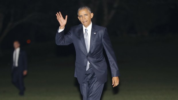US President Barack Obama waves as he returns to the White House after speaking at the Democratic National Convention.