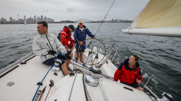 The crew on Salt Shaker, a Sydney 36 design, skippered by Peter Franki (at the helm) pre-start in the CYCA Twilight Series on Sydney Harbour.