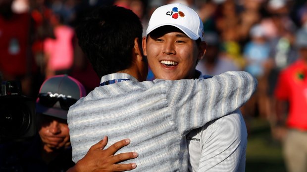 South Korea's Si Woo Kim celebrates on the 18th green after winning The Players Championship.