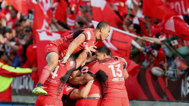 Red alert: Tonga were a hit at the World Cup.