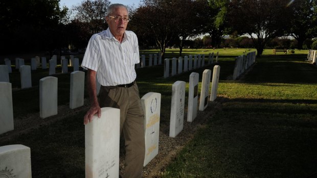 Ron Hamilton at Woden Cemetery where his uncles Rueben Schelbach and Clive Southwell are buried.