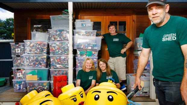 The Green Shed co-founders Sandie Parkes, Elaine Stanford, Tiny Srejic, and Charlie Bigg-Wither with tubs of Lego they are selling via the Green Shed for Canberra Hospital Foundation. Photo: Sitthixay Ditthavong