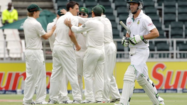Dream debut: Cummins snares South Africa's AB de Villiers in 2011.