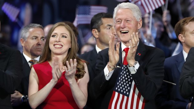 Chelsea Clinton and former president Bill Clinton applaud the nominee on the final day of the Democratic National Convention in Philadelphia.