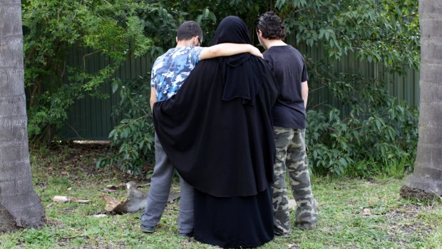 The 16-year-old boy, pictured on the right in 2014, spoke to Fairfax Media after his family home was raided. 