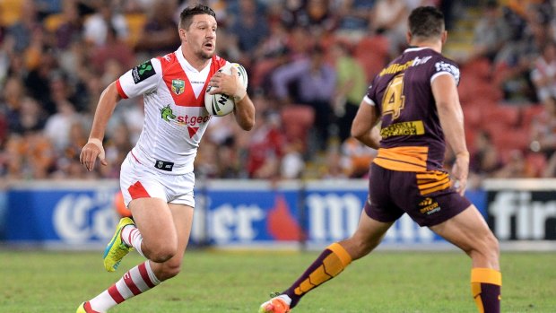 Gareth Widdop makes a break for it during the Dragons clash with the Broncos in April.