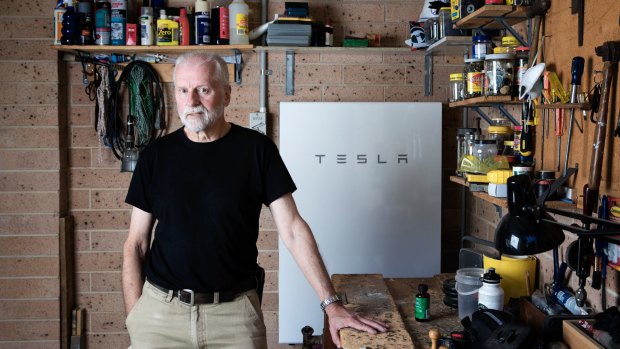 Peter Youll with his Tesla battery, which has paid for itself before the warranty ran out.