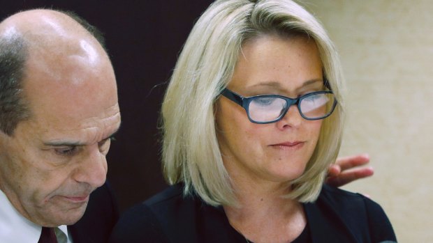 Former Boston television news anchor Heather Unruh wipes tears while speaking about the alleged sexual assault of her teenage son by actor Kevin Spacey in the summer of 2016.