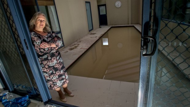Ruth Fenwick's home in Kambah was flooded during the deluge on Saturday due to run-off from the neighbouring property. The pool and surrounding area was filled with muddy water.