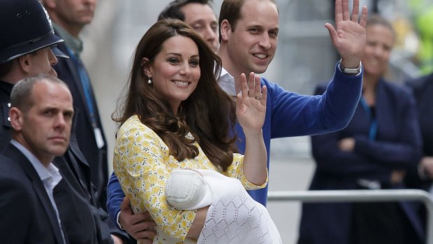 Britain's Prince William and Kate, Duchess of Cambridge with their newborn baby, Princess Charlotte Elizabeth Diana, wave as they leave hospital on Saturday..