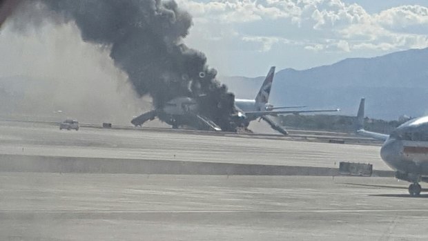 Smoke billows from the British Airways jet at McCarren International Airport, Las Vegas.  