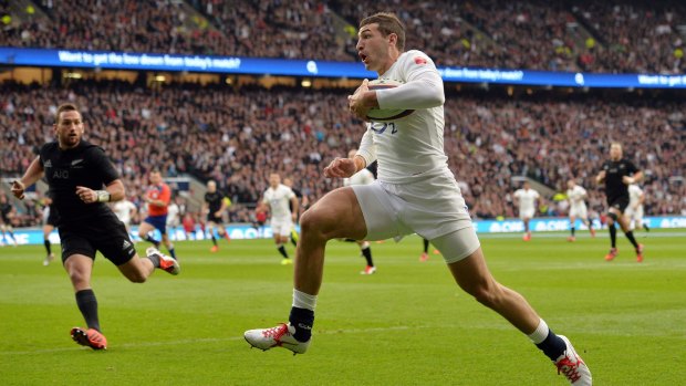 Wonderful try: England winger Jonny May leaves the All Blacks cover defence floundering.