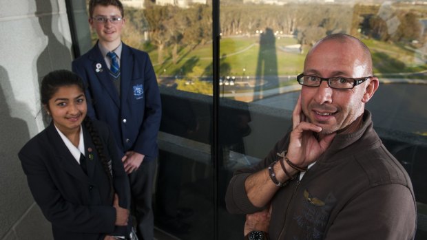 Belgian carillonneur Geert d'Hollander is in Canberra to perform at the National Carillon and inspire budding carillonneurs Kriti Mahajan,15, of Bonner and Peter Bray,15 of Curtin.