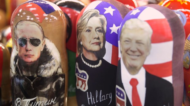 Traditional Russian wooden Matreska dolls depicting from left, Russian President Vladimir Putin, US presidential candidate Hillary Clinton and US President-elect Donald Trump in a shop in Moscow.