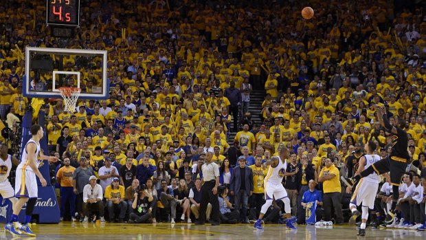 The shot: Cleveland Cavaliers guard Kyrie Irving shoots a three-point basket late in the fourth quarter against the Golden State Warriors.
