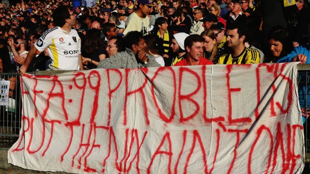 99 problems: Wellington Phoenix fans make their feelings known at Saturday's game against Melbourne Victory.