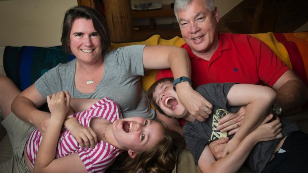 Teresa Crawford and Michael Hess with their nine-year-old twins, Corinne and Henry.