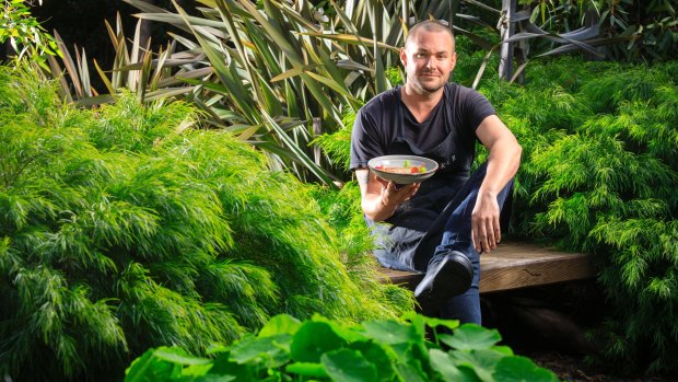 A. Baker head chef Bernd Brademann in the restaurant's garden in New Acton.