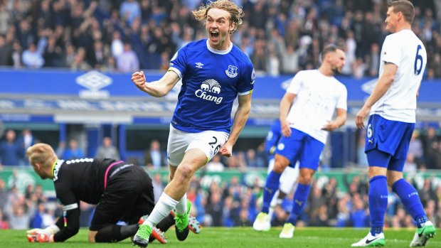 Tom Davies celebrates scoring for Everton.