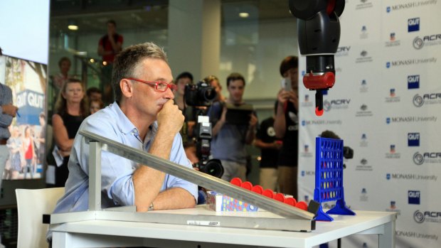 Professor Peter Corke, a world-renowned roboticist with QUT's Science and Engineering Faculty and Director of the Australian Centre for Robotic Vision (ACRV), plays Connect Four with Baxter.