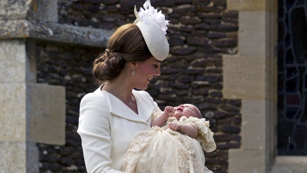 Proud mum Kate with baby Charlotte outside the church. 