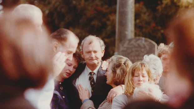 Peter Acocks with family and friends at the funeral of his wife, Claire.
