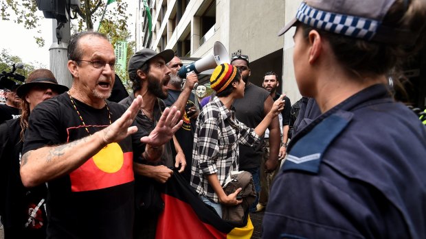 Protesters confront police outside Parliament House last week, demonstrating against the NSW government's anti-protest laws.