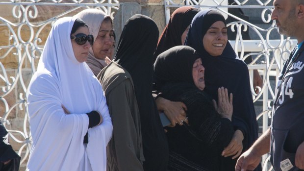 Ahamd's mother and sister (second from right and right) attend the funeral at Lakemba Mosque on Thursday.