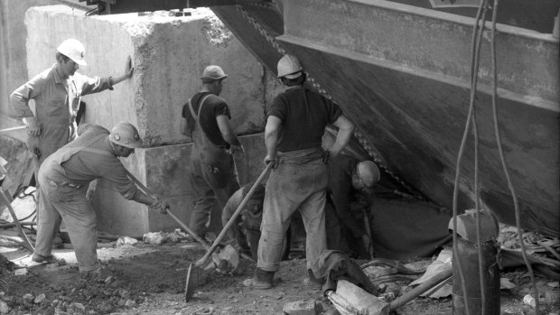 Workmen search for survivors in the rubble after the collapse of the West Gate Bridge on October 15, 1970.
