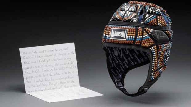 NRL Johnathan Thurston chose a letter from a young fan and his NRL Allstars head gear to go in the exhibition.