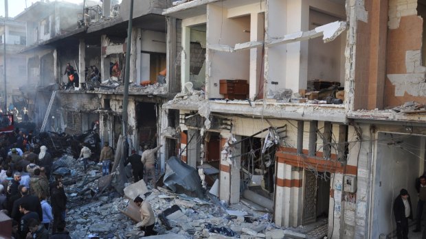 Damaged buildings in the Syrian government-held neighborhood of Zahraa, Homs, in 2015.