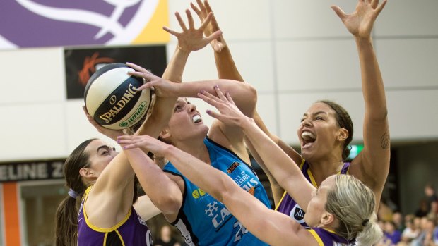 The Canberra Capitals are preparing for Melbourne's Liz Cambage [right] just two weeks after she kneed Mistie Bass. 