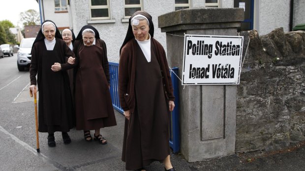 Carmelite sisters leave a polling station in Malahide, County Dublin, Ireland.