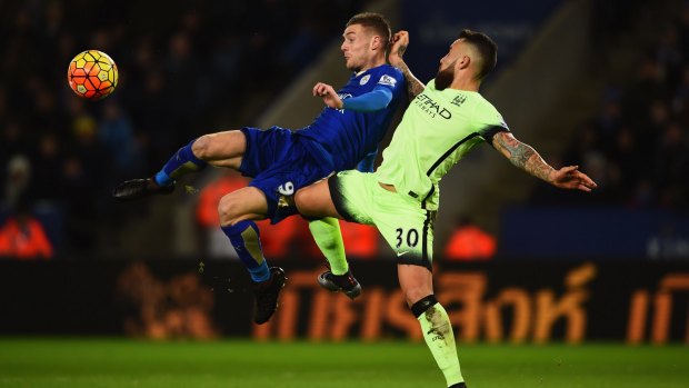 Jamie Vardy of Leicester City is challenged by Nicolas Otamendi of Manchester City.