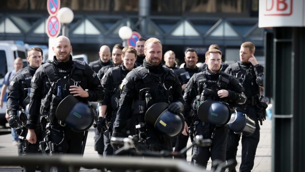Riot police patrol ahead of the G20 in Hamburg.