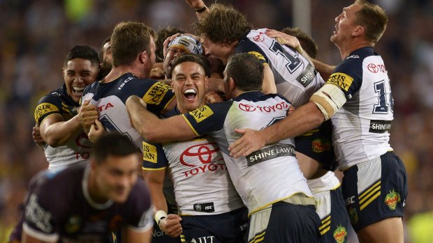 Greatest game of all: The Cowboys celebrate victory in last year's grand final.