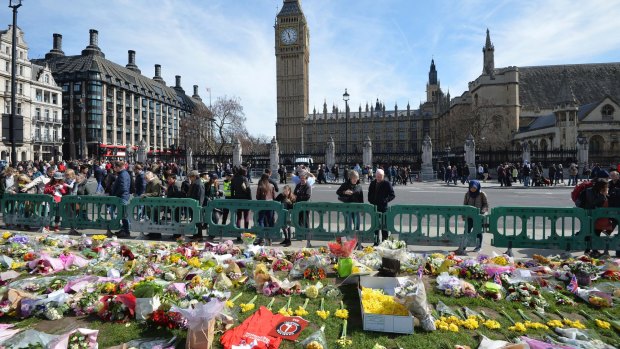 Tributes in London's Parliament Square for those who lost their lives in the attack.