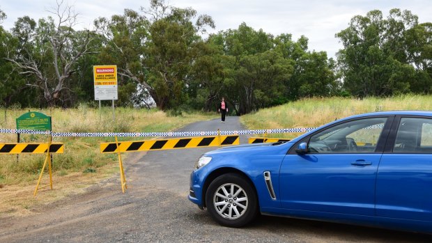 Police seal off a site near Butlers Falls on Tuesday as they search for Lateesha Nolan's remains.