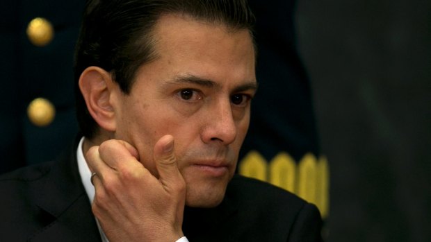 A journalist who exposed Mexican President Enrique Pena Nieto (pictured) over a luxury home found spyware on his phone.