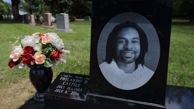 A bouquet of flowers adorns the grave of Philando Castile on July 16, 2017, the one-year anniversary of his death. 