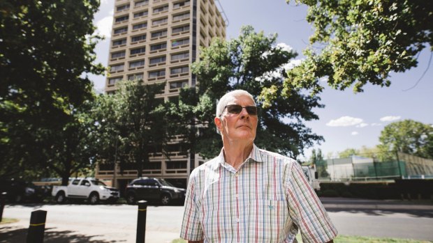 Gary Petherbridge stands in front of Kingston Tower, a building he believes was built correctly unlike developments now.