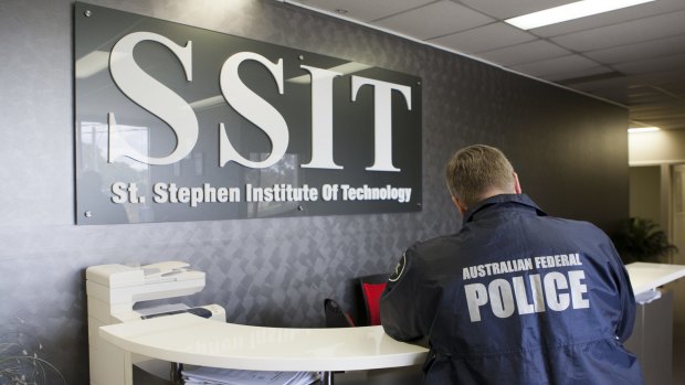 AFP officers at St Stephens Institute of Technology. Its owners were charged with serious fraud offences on Wednesday.