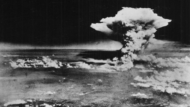 Plume of smoke billows an hour after the nuclear bomb was detonated above Hiroshima, Japan on August 6, 1945. 
