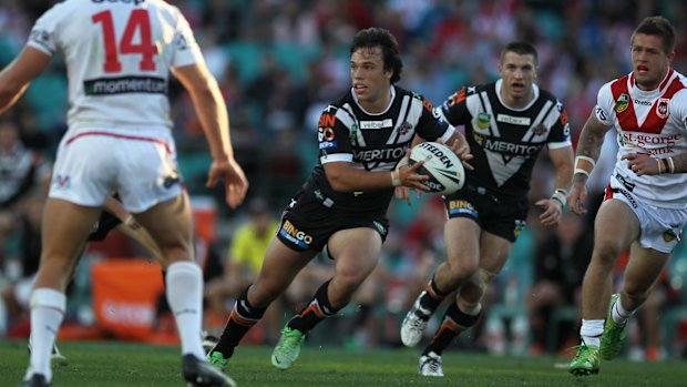 Delightful debut: Luke Brooks on the charge against the Dragons at the SCG in 2013.