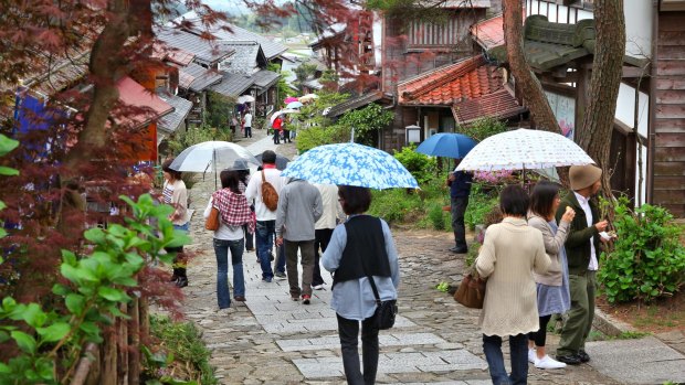 People visit old town of Magome. Magome-juku was a historic post town of famous Nakasendo trail between Kyoto and Edo.