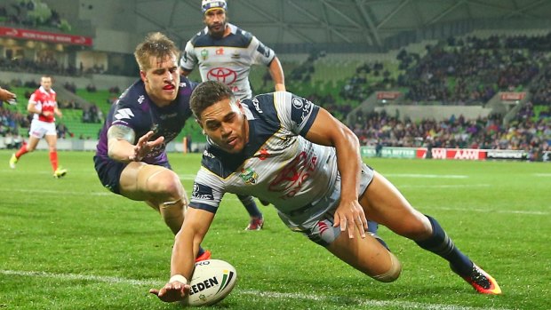 MELBOURNE, AUSTRALIA - SEPTEMBER 10: Antonio Winterstein of the Cowboys scores a try as Johnathan Thurston looks on during the NRL Qualifying Final match between the Melbourne Storm and the North Queensland Cowboys at AAMI Park on September 10, 2016 in Melbourne, Australia. (Photo by Scott Barbour/Getty Images)
